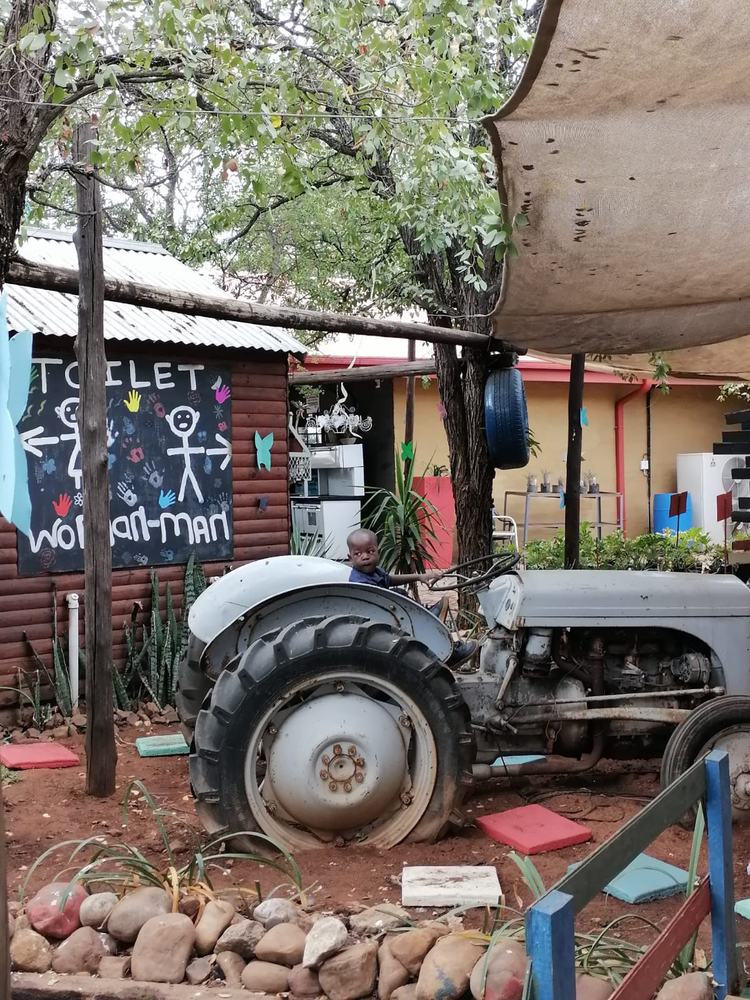 Vintage tractor near play area